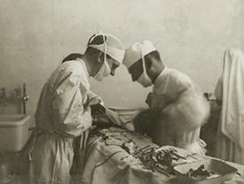 Old photo of doctors operating 